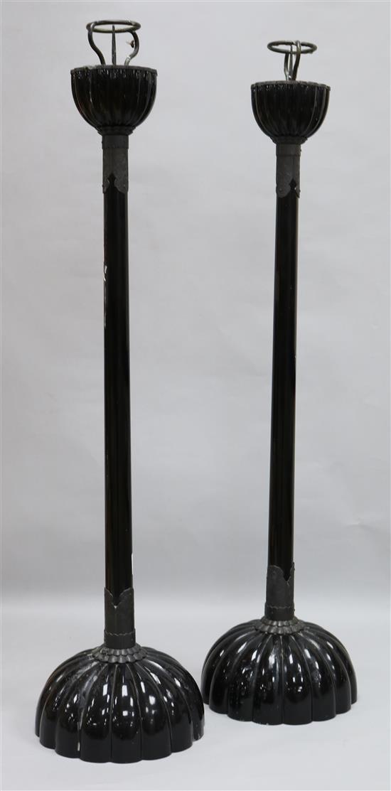 A pair of fluted metal candlesticks, H.72cm